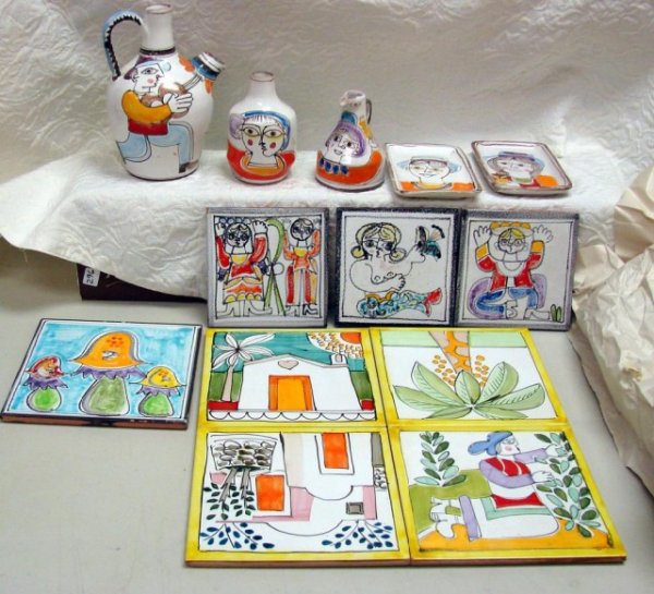 12 pcs DeSimone Pottery: tiles, jugs, cruet & tray: 12 pieces of DeSimone Pottery consisting of 5 8 tiles, 3 5 3/4" tiles, a 9" jug, small jug, 1 cruet and 2 trays. Individually hand crafted and hand painted with unleaded colors, De Simone pottery adds