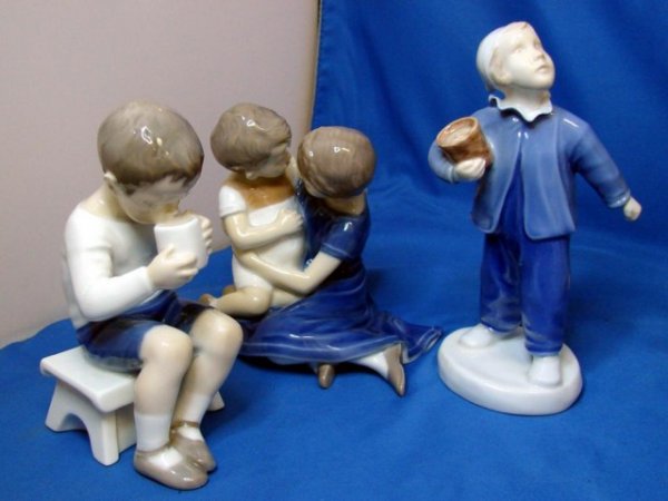 3 Bing & Grondahl Denmark Figurines - Children: 3 Bing & Grondahl Figurines, made in Denmark: a little girl and boy with their arms around each other, a little boy on a bench, and a boy in PJ's & stocking cap, no chips or cracks.