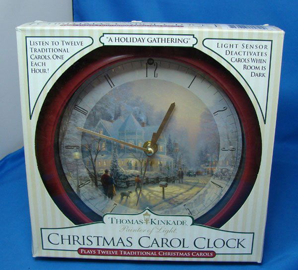 Thomas Kinkade Clock 12 Christmas Carols: Thomas Kinkade Painter of Light Clock plays 12 Christmas Carols, one every hour. Light sensitive, doesn't play in the dark, with box.