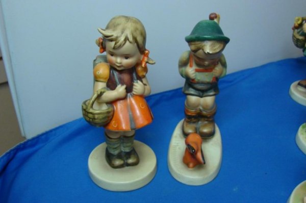 Vintage Hummel Figurine School Girl & Boy&Rabbit: Vintage Hummel Figurine School Girl TMK 2, no chips or cracks, and a little boy with a rifle and rabbit, looks quite old and has a hairline running across bottom, can't be seen from top.