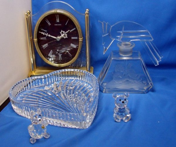Crystal Heart Dish, Swarovski Bear, Seiko Clock: Box lot consisting of a heavy crystal Heart Dish 7", a Swarovski Bear, a quartz Seiko Clock, large perfume bottle with a woodpecker stopper, & a small crystal bear.