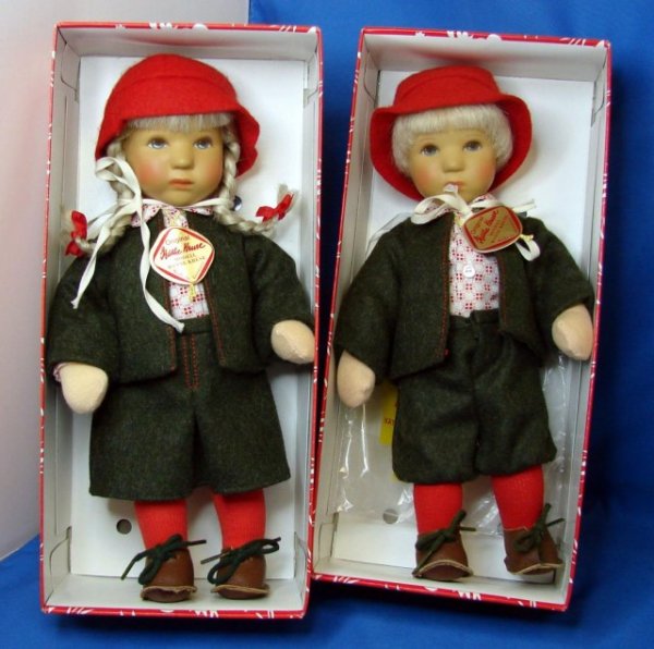 Pair of Kathe Kruse Dolls, Boy & Girl: Two Kathe Kruse Dolls, beautifully dressed in green wool with red socks and hats, in original boxes, like new, approx. 10" tall.
