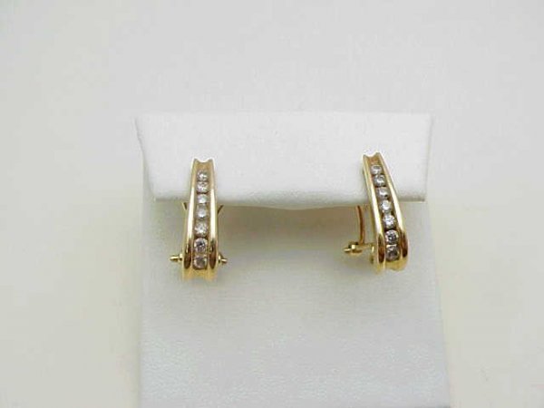 lady's 14kyg diamond earrings: Lady's 14kyg diamond earring weighing 4 grams consisting of graduated round channel set diamonds in a bar design weighing .40ctw with omega backs.
