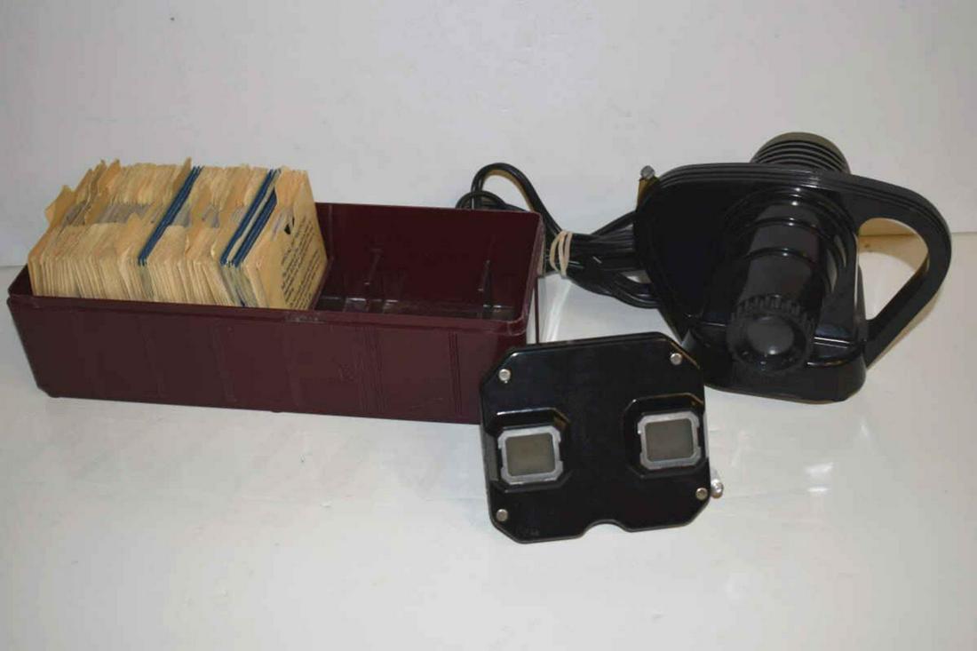 Viewmaster and Viewmaster Projector with Slides: Viewmaster and Viewmaster Projector with Slides. Vintage with original boxes and paperwork, projector is in working order, 4 1/2"h.