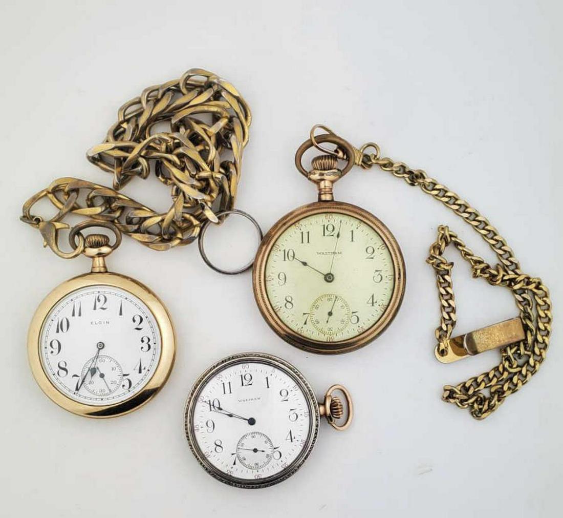 Lot of three gold plated pocket watches: Lot of 3 gold plated pocket watches. Makers including Waltham and Elgin. All watches have white dials with Arabic numerals and threaded case backs. Waltham with a 15j movement # 18378257, Elgin with a
