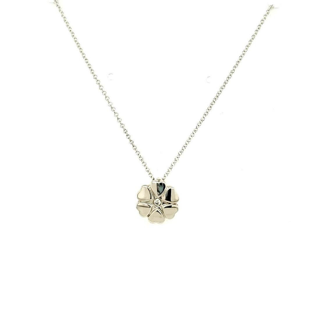 Tiffany & Co Sterling Crown of Hearts necklace: Ladies sterling silver Tiffany & Co Paloma Picasso crown of hearts pendant featuring a circle of hearts accented with a bezel set round diamond weighing 0.02ct. Hanging from a 16" chain. Weight 2.7. C