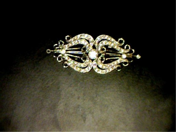 Lady's 18kwg vintage diamond pin: Lady's 18kwg vintage filigree diamond pin 12.8 grams consisting of round bezel and prong set diamonds in milgrain bars approx. 1.20ctw. A very beautiful piece.
