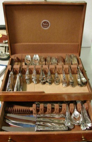 Svc. for 16 Silver plate from Neiman Marcus: 80 pcs. Silverplate Service for 16 purchased from Neiman Marcus: 16 ea diner and salad forks, spoons, tablespoons and knives, with wooden tarnish proof box.