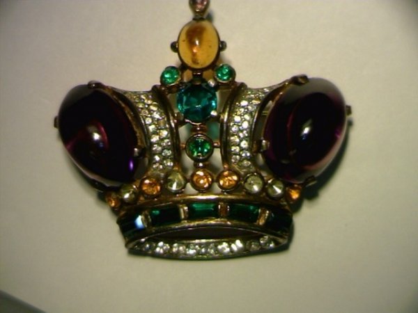 Beautiful Trifari crown jewel pin: Beautiful Trifari crown jewel pin in sterling silver with gold overlay containing purple,green yellow and white jewels cabochon and faceted 2" by 11/2".