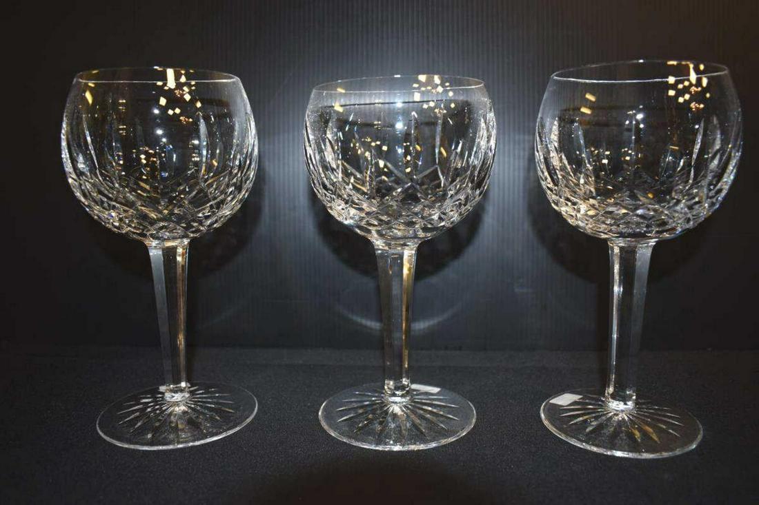 Three Waterford Lismore Cut Crystal Balloon Wine: Three Waterford Lismore Cut Crystal Balloon Wine or Water Goblets. 7 3/8" tall, 3 5/8" mouth diameter. Star pattern foot is 3 1/2". Acid etched hallmark on each. Angular tapered stems.