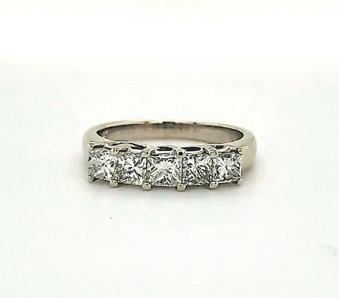 14kt white gold diamond band: Ladies 14kt white gold diamond band featuring prong set princess cut diamonds weighing approx. 1.00ct., Clarity SI2, Color I-J. Finger size 7, Weight 4.2 grams.