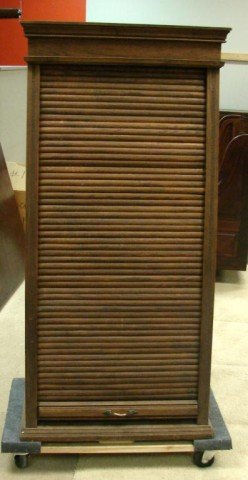 Antique Oak Cabinet for Railroad Ticket Sales: Antique Roll Front Storage Cabinet, used to hold Railroad Tickets, from the 1930's, front rolls up and down like a roll-top desk; 54" high x 18" deep x 25" wide.