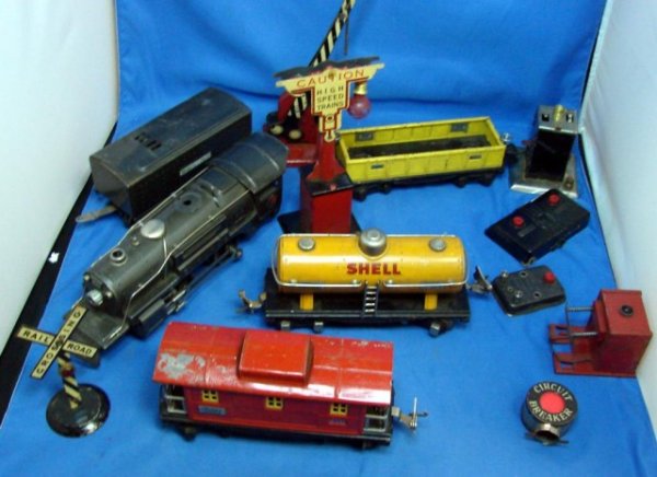 Antique Lionel "O" Gauge Train Cars: Antique Lionel Train Cars including a Shell Oil tanker and a heavy engine, and an old instruction book.