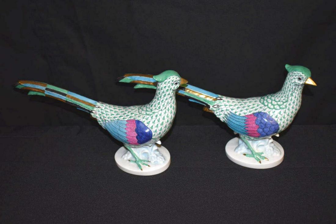 Pair of Herend Porcelain Pheasant Figurines: Pair of Herend Porcelain Multicolor Pheasant Figurines. This great complimentary pair of handpainted birds are primarily in turquoise but feature several different colors. They are 12.75" long & 6.5" 