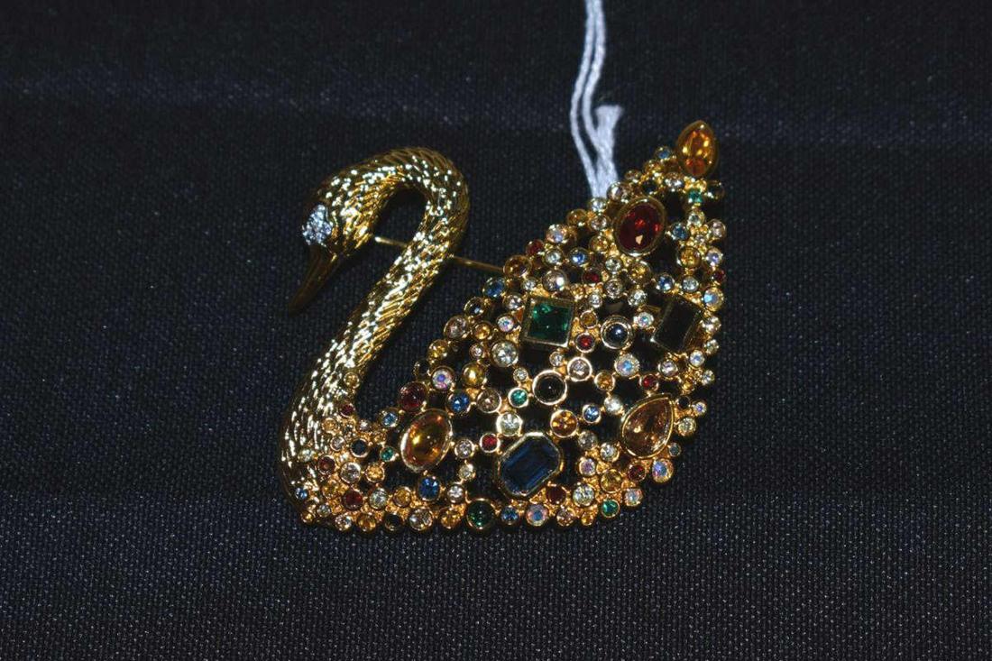 Swarovski Centenary Swan Brooch: Swarovski Centenary Swan Brooch. Gold tone swan with colored Swarovski crystal accents, this was only made available to SCS members in 1995, 1 3/4"h., with original box, packaging and papers.
