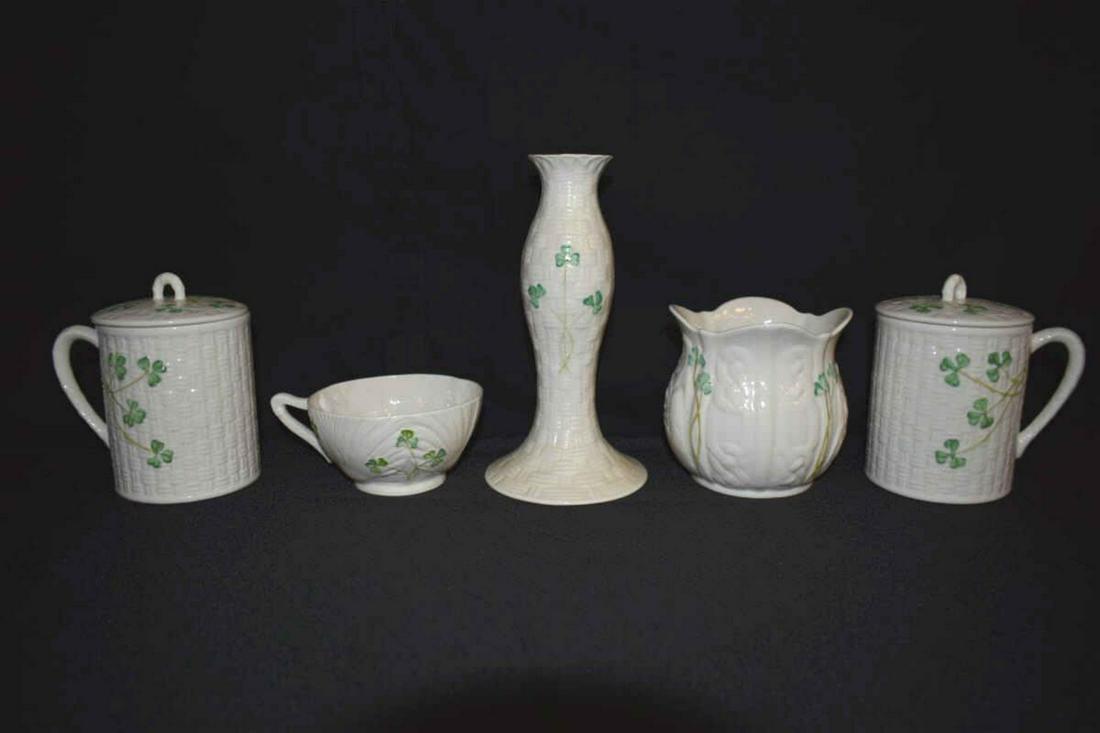 Five Pieces of Late Belleek: Five Pieces of Late Belleek. All with the 11th mark, two covered pots, 5 1/4"h., a vase, 4 1/2"h, candlestick, 7 3/4"h. and teacup, 2"h.