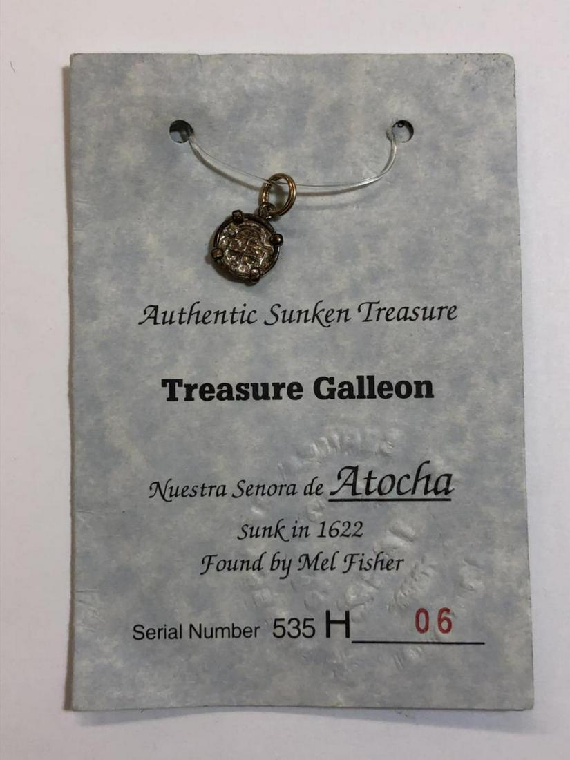 Silver Coin Pendant from Atocha Silver Bar w/COA: Silver Coin Pendant from Atocha Silver Bar w/COA. This replica coin was made from silver bars salvaged from the Atocha shipwreck by Mel Fisher. Comes with numbered Certificate of Authenticity. Pendant