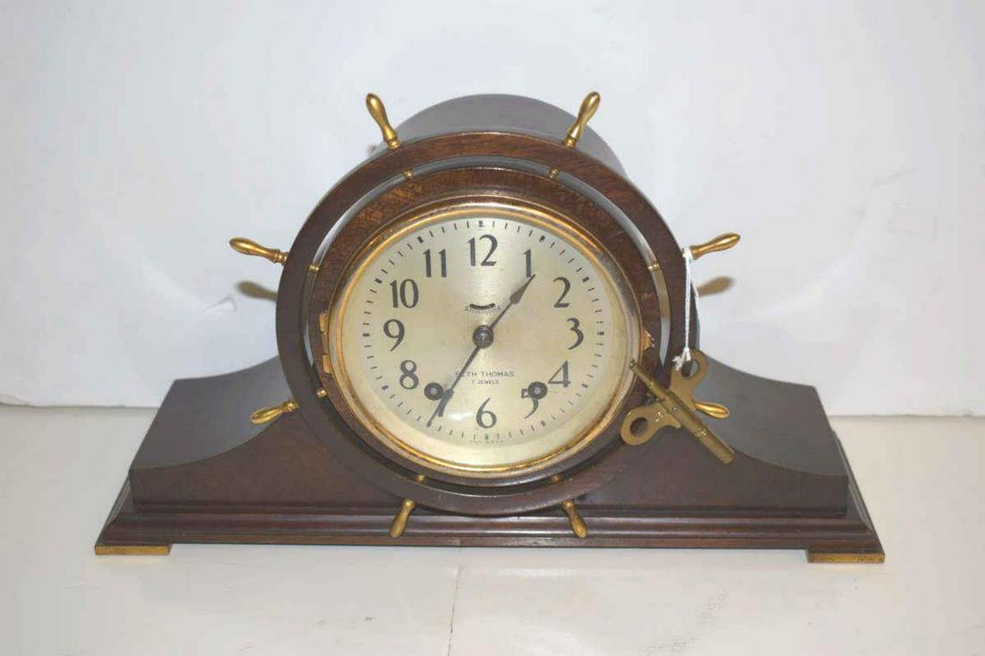 Seth Thomas Ship's Wheel Mantle Clock: Seth Thomas Ship's Wheel Mantle Clock. Eight day, time/strike seven jeweled movement with tin dial, brass accents and mahogany case on pad feet, 8 1/2"h.