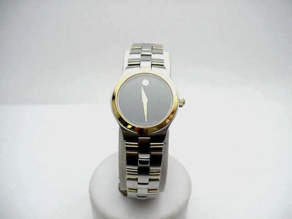 Lady's 2 tone Movado Museum watch: Lady's stainless and gold Movado Museum watch Swiss made, water resistant, sapphire crystal and quartz movement.