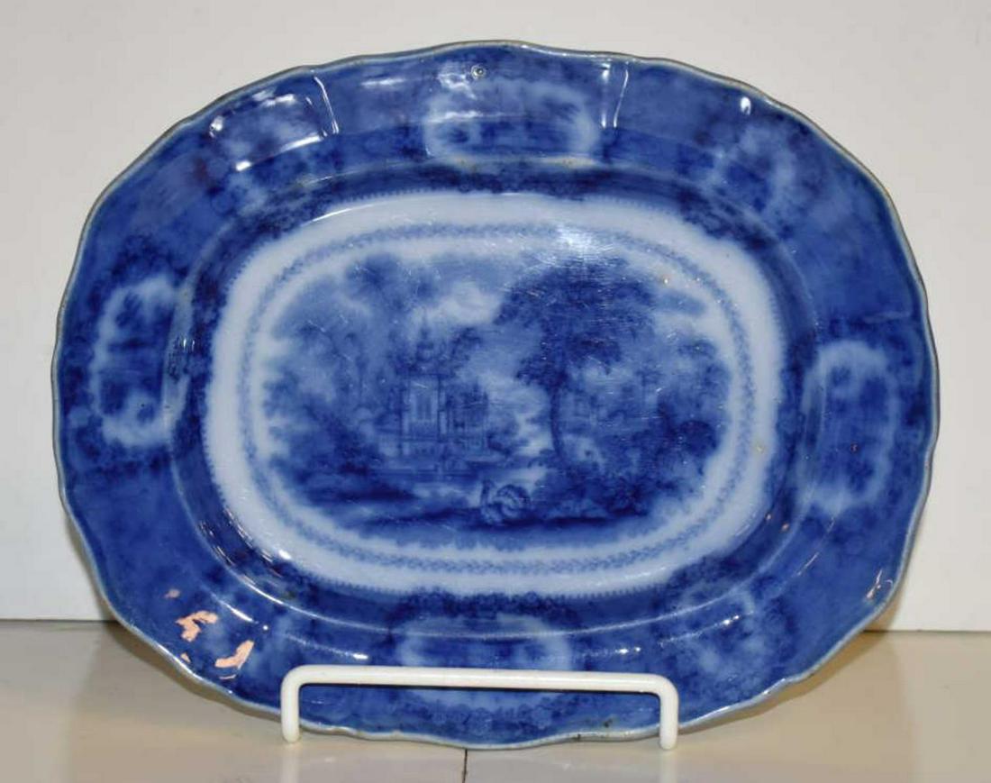 Flow Blue Platter: Flow Blue Platter. Beautiful flow blue platter depicting a castle scene, 11"w.