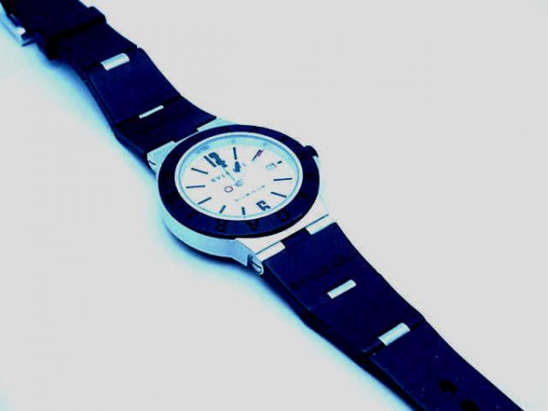 Man's Bvlgari Diagono Chronograph watch: Man's Bvlgari Chronograph watch features include sapphire crystal, aluminum case, pearlized white dial with black enamel markers and black rubber and aluminum band.