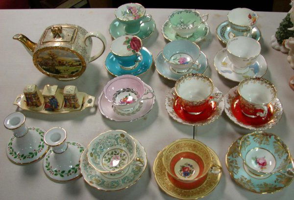 13 English Bone China Tea Cups + Teapot: 13 English Bone China tea cup & saucers sets, a musical teapot, a Royal Winton tray with salt, pepper & mustard pot set, and a pair of Christmas candlesticks. No chips or cracks.