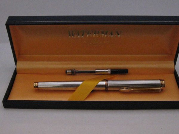 Man's Waterman "Gentleman" sterling fountain pen: Man's Waterman "Gentleman" sterling silver fountain pen with hallmark, yellow gold overlay on the clip, 18k nib and extra cartridge. Comes with original box. Made in France.