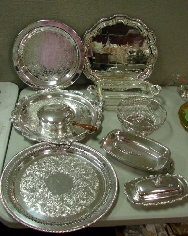 9 pcs. Silver plate incl. Sheffield Silent Butler: Lot of Silver Plate including a Sheffield silent buttler, butter dish with glass insert, several trays, pyrex loaf pan in silver holder, etc. All in excellent, polished condition.