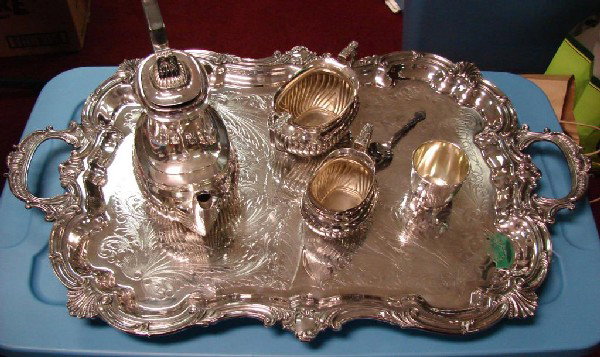 1930's Ornate Silver Plate Tray, Coffee Pot, ++: Heavy silver plate tray, 29" x 18" with a coffee pot, sugar and creamer, and a spoon, stamped Made in England; tray is quite heavy and is may be silver plated pewter. Purchased in Europe the 1930-40's