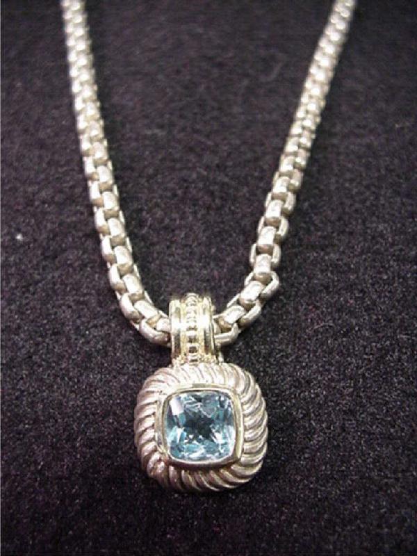 Lady's sterling/14kt David Yurman necklace: Lady's sterling and 14kt yellow gold David Yurman necklace 28 grams with one checkerboard square blue topaz 7mm bezel set in 14ky and sterling with 16" link chain.