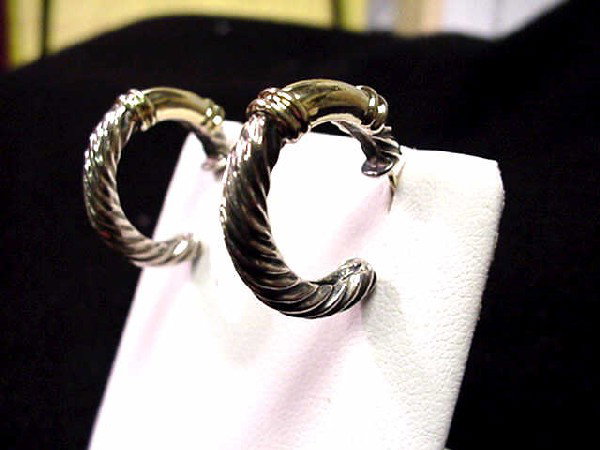 Sterling/14kyg David Yurman earrings: Lady's sterling and 14kyg David Yurman hoop earrings 9.9 grams with 14kyg accent on each earring and 15mm inside diameter.