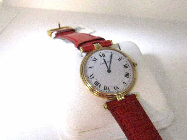 Man's 18kg Cartier Vendome watch: Man's 18kyg Cartier Vendome watch with white enamel Roman dial, sapphire crown, 3 color bezel and three authentic Cartier bands.