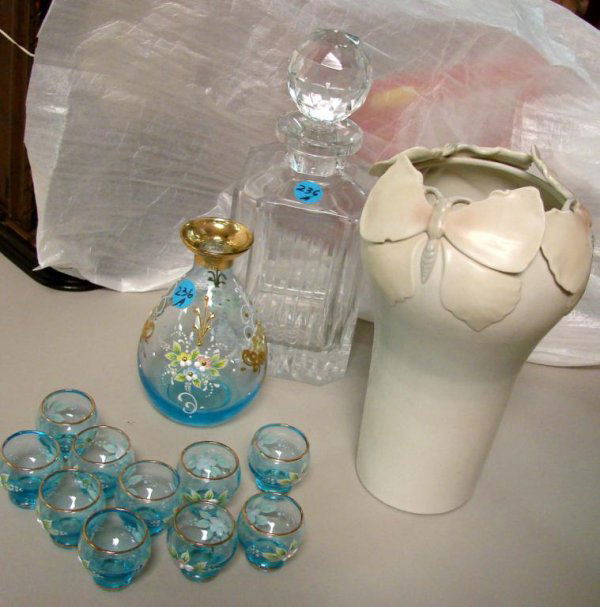 Enameled Blue Glass Decanter & 10 glasses: Enameled Blue Glass Decanter, 5.75" tall, and 10 matching small glasses, a crystal brandy decanter and a glazed pottery vase with butterfly motif.