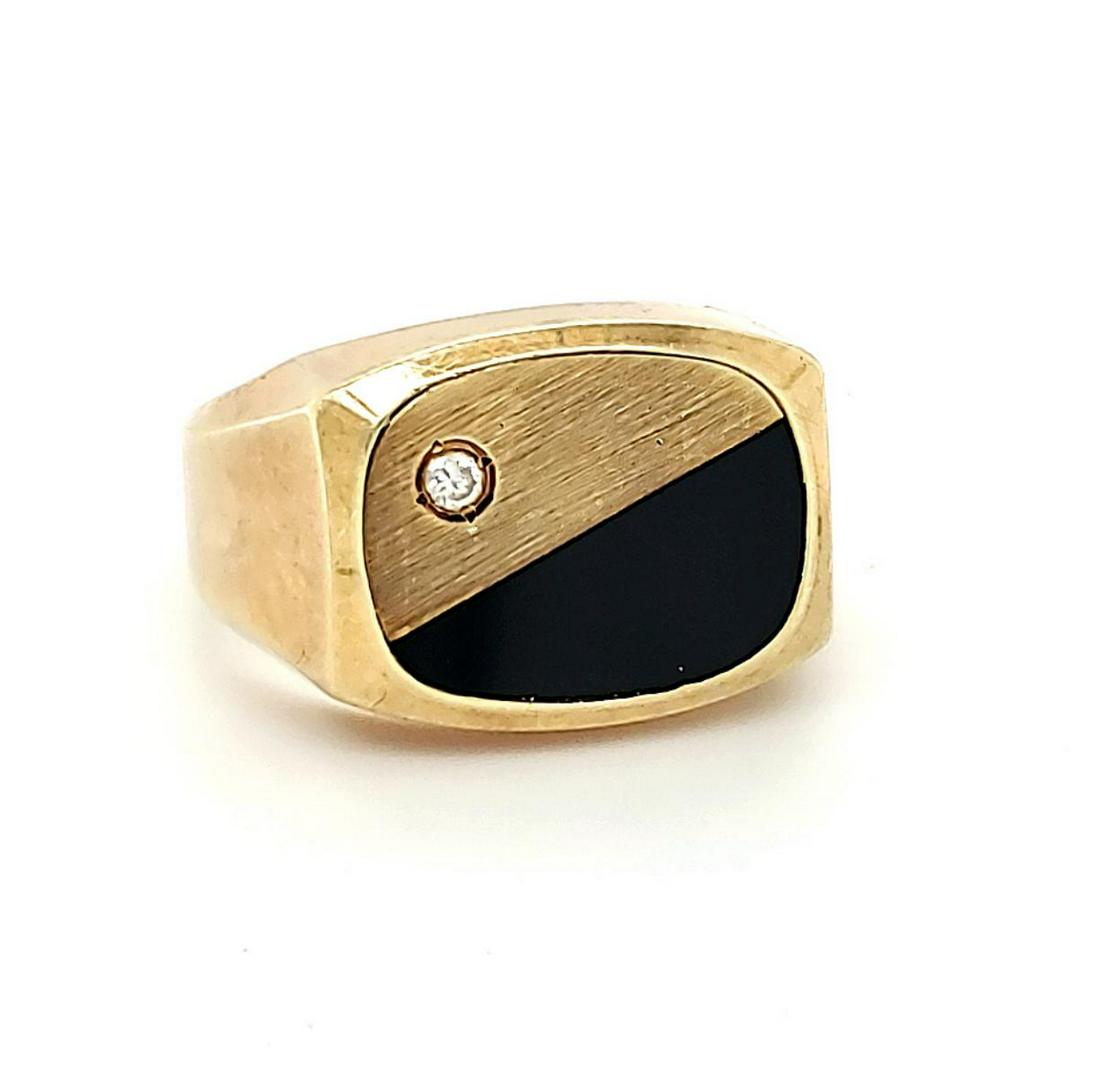 14kt yellow gold diamond and enamel ring: Men's 14kt yellow gold diamond and enamel ring featuring square design, accented with black enamel, satin finish and a prong set round brilliant cut diamond weighing approx. 0.03ct. Finger size 8. Wei