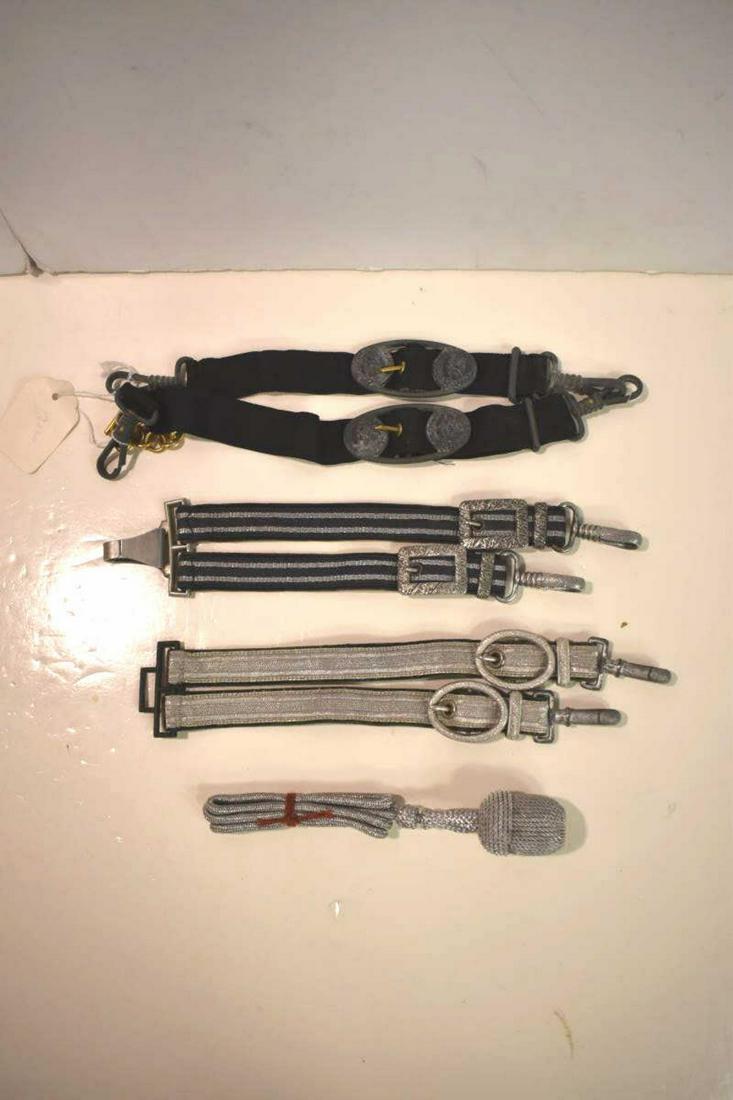 Group of Nazi Germany Dagger Hangers & Knot: Group of Nazi Germany Dagger Hangers & Knot. Trio of interesting hangers including black & silver set with rectangular buckles with oak leaves. Also a set primarily silver with oval shaped buckles. Al