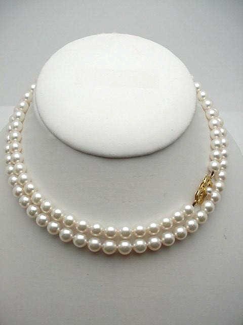 30" strand Mikimoto 6 1/2-7mm pearls: Lady's beautiful 30" strand of Mikimoto pearls with beautifully matched pearls measuring 6 1/2-7mm rose lustre individually knotted with signature 18kyg pearl clasp.