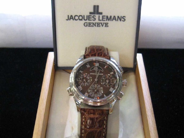 Man's Jacques Lemans Chronograph watch: Limited edition man's Jacques Lemans chronograph watch with chocolate moonphase dial, water resistant, sapphire crystal,original band and box. Only 1000 made.