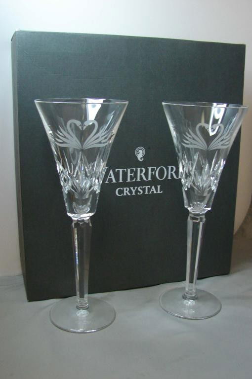 6 Waterford Champagne Flutes (4 Love & 2 Wedding): 6 Waterford champagne flutes; 4 are Millennium 2nd toast "Love" with boxes (worn) and 2 are from the Wedding Collection, with like new box. No chips or cracks.