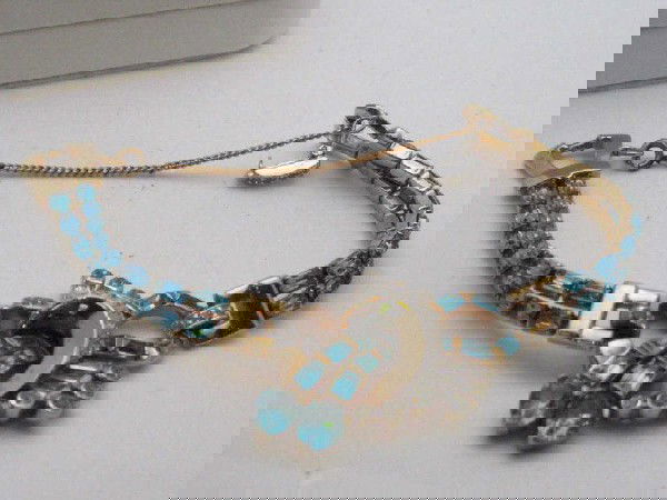 3 pc set necklace,bracelet,pin Mazer Bros.: 3pc set costume jewelry by designer Mazer Bros with blue and white rhinestones baguette, emerald and round cuts in an art deco design very well constructed.