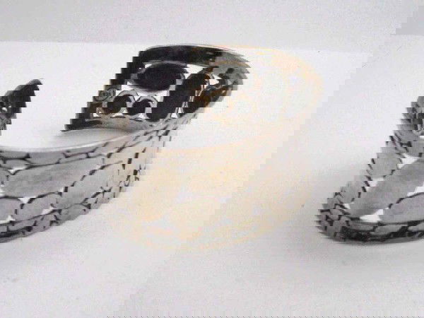 John Hardy sterling cuff bracelet: John Hardy sterling cuff bracelet 58 grams with circle shaped designs in a 1 1/4" wide bracelet .