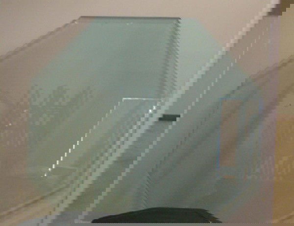 Octagonal 60" Beveled Glass Table: Octagonal 60" Beveled Glass Table Top, low black base, can be used as coffee table or dining room table.
