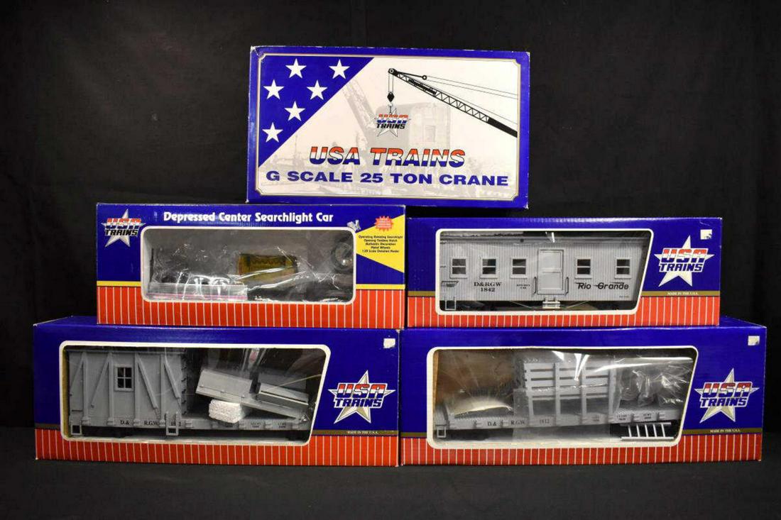 Lot of 5 U.S.A. Trains in Original Boxes "G" Gauge: Lot of 5 U.S.A. Trains in Original Boxes "G" Gauge. Included is a Depressed Center Searchlight Car 1:29 scale, D&RGW Rail & Tie Car made in the USA, also included is a G Scale 25 Ton Crane R-1862 Denv