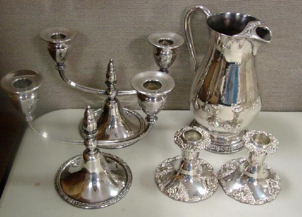 2 Silver Plate 2-Arm Candelabra, Pitcher: 2 Silver Plate 2-Arm Candelabra, matching Pitcher in the Camille pattern, and a pair of ornate candle sticks.