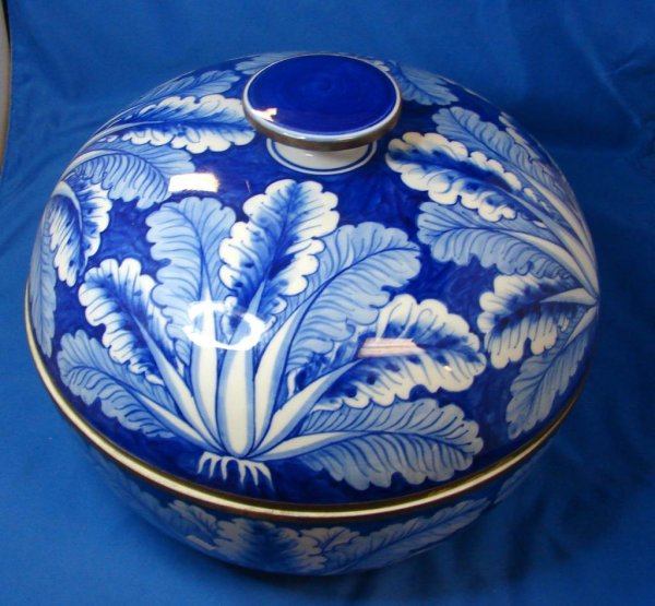 Vintage Flow Blue Covered Centerpiece Bowl: Vintage Cobalt or Flow Blue Covered Centerpiece Bowl, 11 1/2" diameter, no chips or cracks and no marks on bottom. Very unusual piece; we believe it to be about 100 years old.