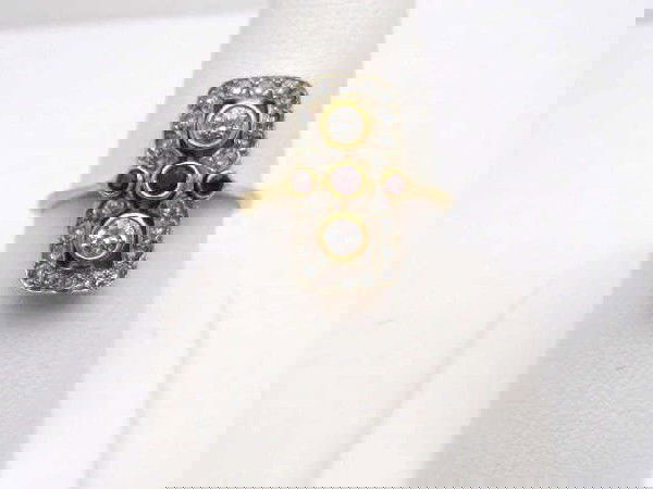 18kyg vintage ruby & diamond ring: Lady's 18kyg vintage ruby and diamond ring 6.5 grams with 2 bezel set diamonds and three bezel set rubies mounted through the center with pave diamonds surrounding all in a rectangular design with fin