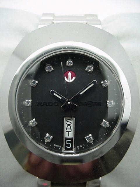Stainless Rado Diastar automatic watch: Man's Rado Diastar stainless automatic watch with black slate dial, day and date, water resistant, Swiss movement, sapphire crystal and never been worn. Comes with box and papers.