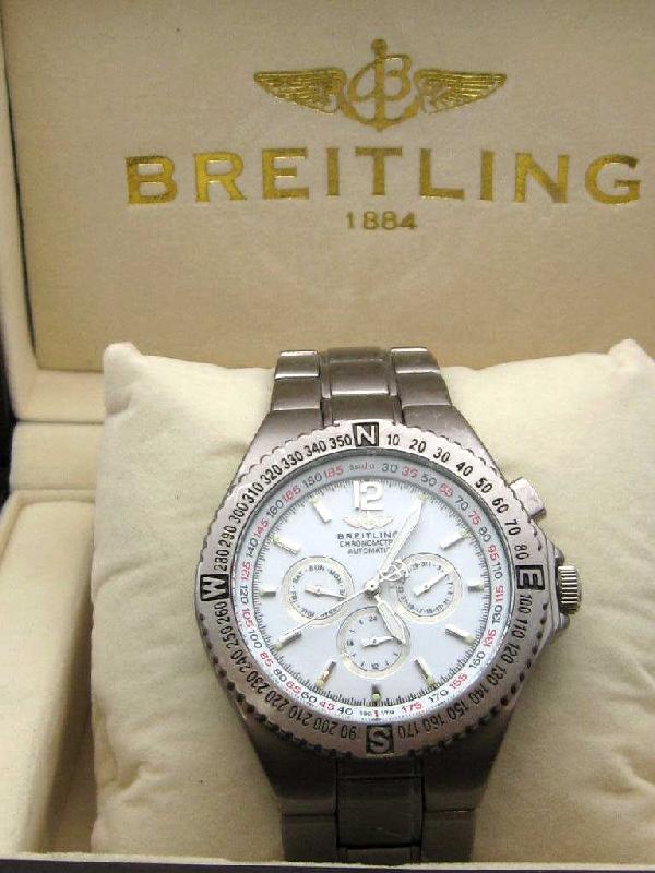 Stainless Breitling Chronograph watch: Man's stainless Breitling Chronographe Etanche, 50mm dive, day date dials, automatic movement model #A68062 with box.