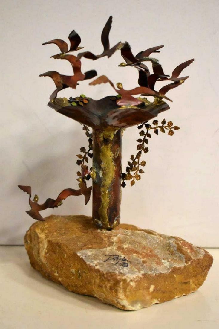 Brian Bijan Signed Copper Sculpture On Stone Base: Brian Bijan Signed Copper Sculpture On Stone Base. A depiction of birds in flight near a birdbath with floral accents. 6.5" wide & 4" deep. 8.5" tall. {American 20th century} Rustic by design with pat