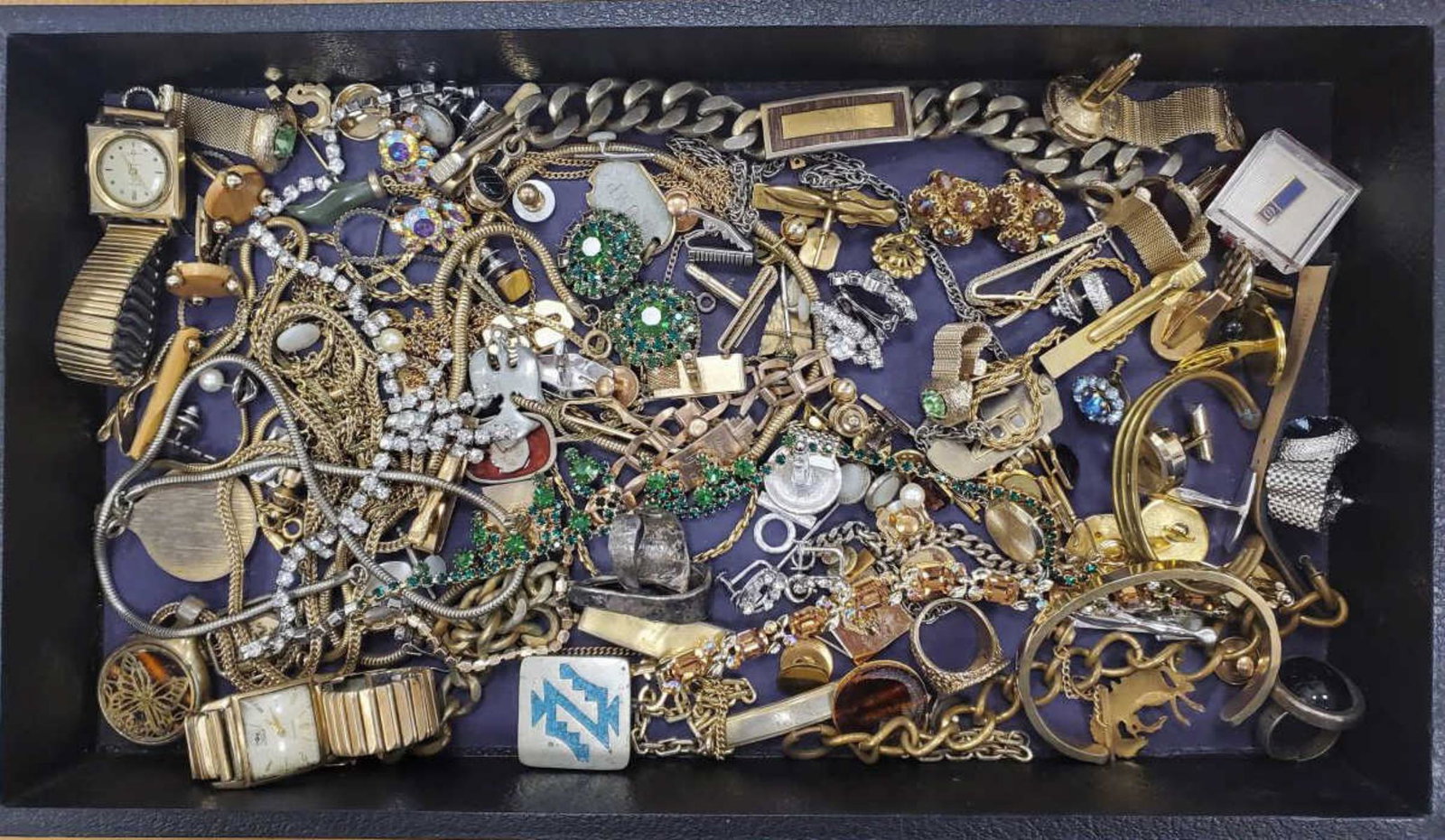 Lot of costume jewelry: Lot of costume jewelry including many pairs of cufflinks, men's bracelets, men's watches, rheinstone necklaces and earrings, fancy link chain and more.