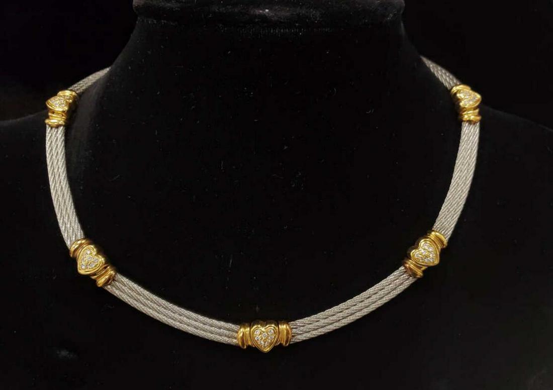 18kt and stainless Philippe Charriol necklace: Ladies 18kt yellow gold and stainless collar necklace by Philippe Charriol featuring cable links alternating with yellow gold heart shaped links accented with prong set round brilliant cut diamonds we